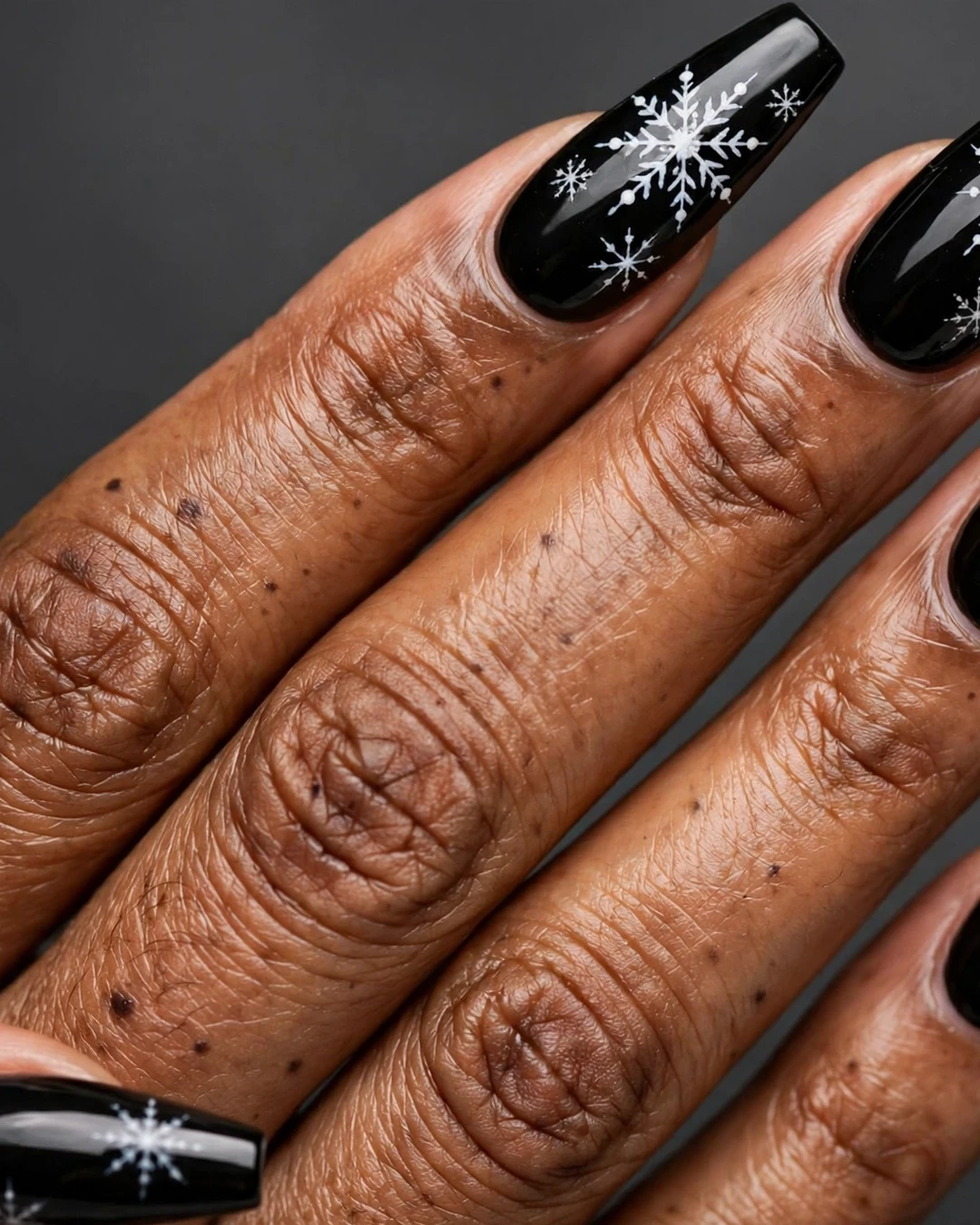 White Snowflakes on Jet-Black Nails