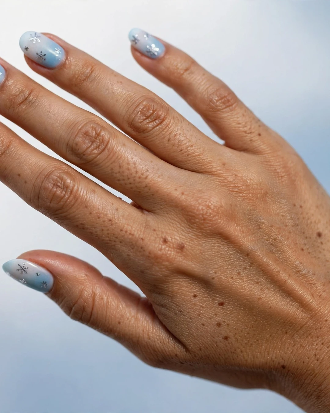 Frosty Blue Ombre Snowflake Nails